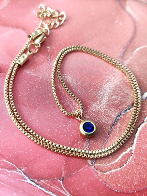 Steel necklace new gold color with blue stone