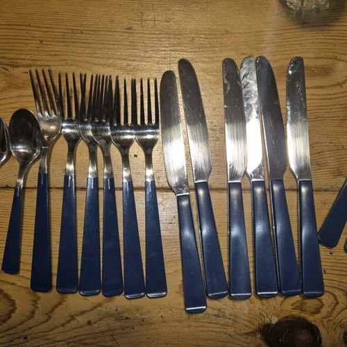 Blue cutlery set used, missing small spoon