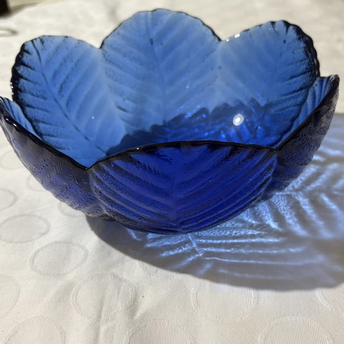 Vintage round blue glass vase with embossed flower design