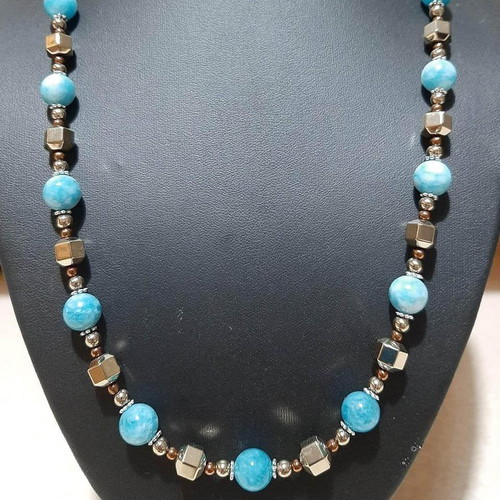 Necklace with dark blue larimar and gold hematite on steel