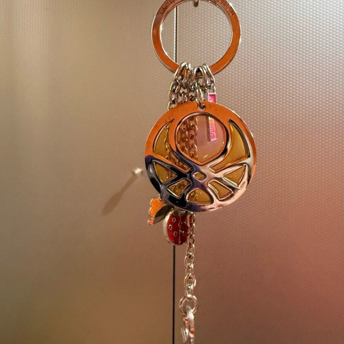United Colors of Benetton silver keychain like new