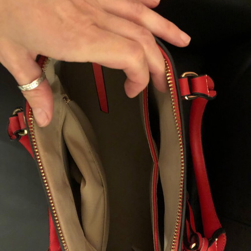 Red handbag used with wear marks
