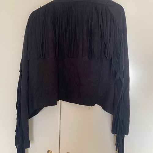 Women's short jacket used with fringes and castor texture