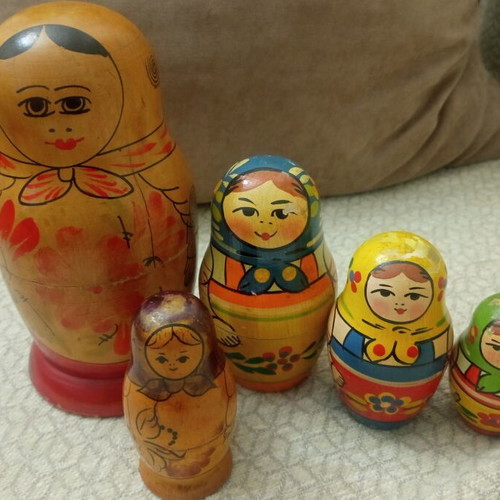 Wooden folk art figures set used, different babushkas