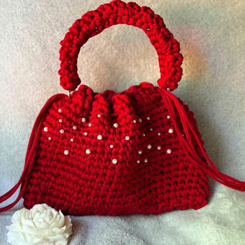 Handmade red drawstring bag with pearls