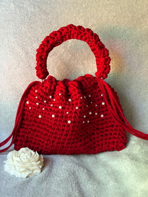 Handmade red drawstring bag with pearls