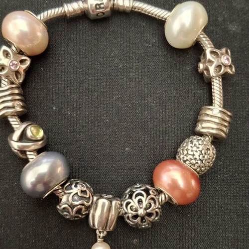 Pandora silver bracelet new with 13 charms