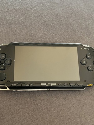 PSP 1004 handheld console with Crash and MediEvil games