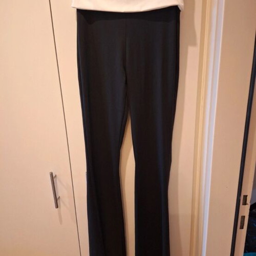 Elastic bell-bottom pants one size fits S and M like new, black and white