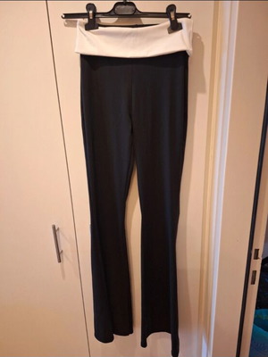 Elastic bell-bottom pants one size fits S and M like new, black and white