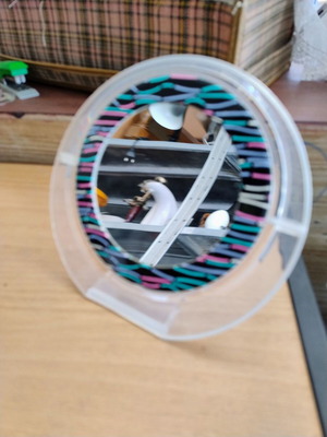 Makeup tabletop mirror with two sides used