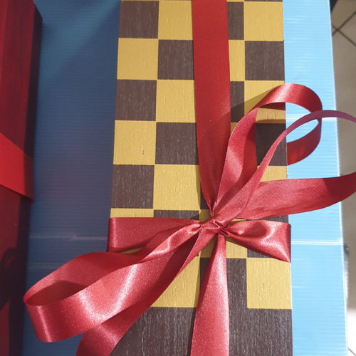 Wooden chessboard with organic Limnos wine in gift packaging new