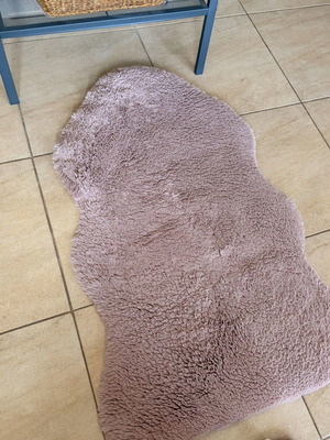 Soft rug used, small pink with gentle texture