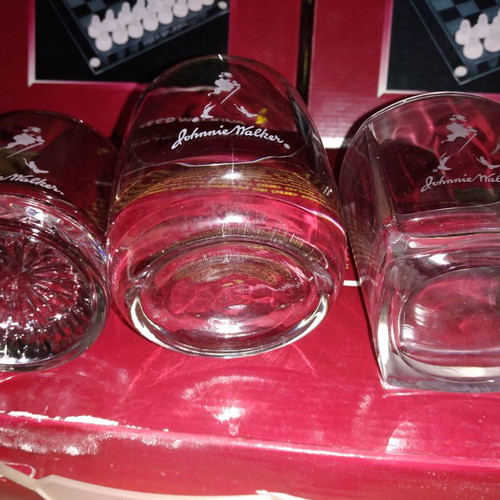 Johnnie Walker collectible set new with chess, whiskey glasses, and metal box