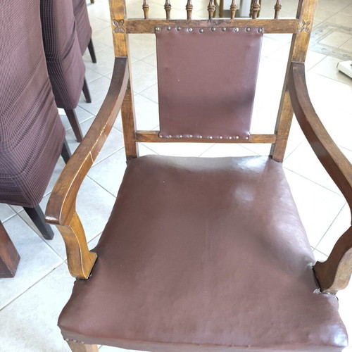 Vintage armchair refurbished with carved wood and leather backrest