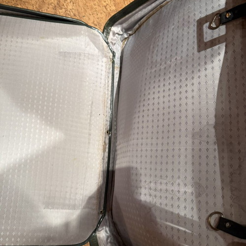 Vintage leather suitcase in dark green