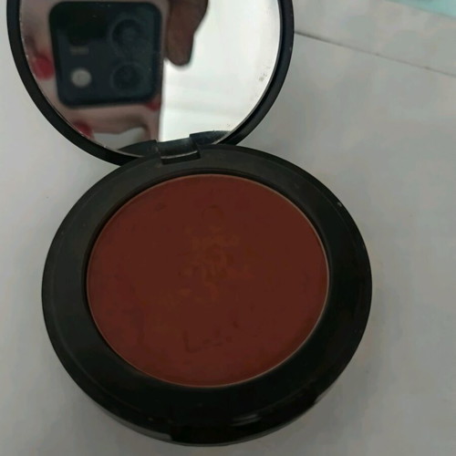 Dust and cream compact blush in coral brown shade