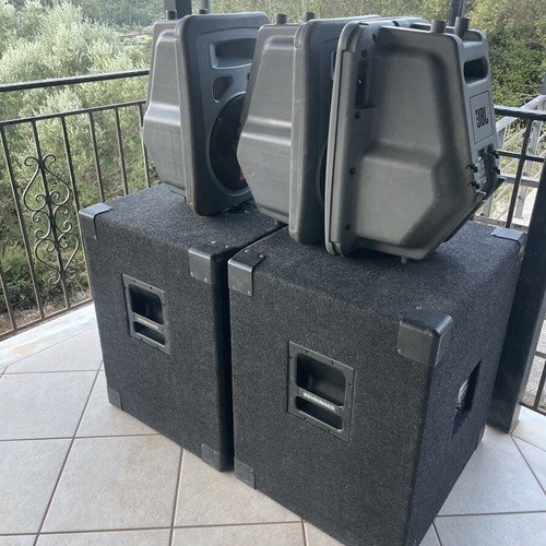 Professional speakers with 2 large subwoofers and 3 small JBL speakers