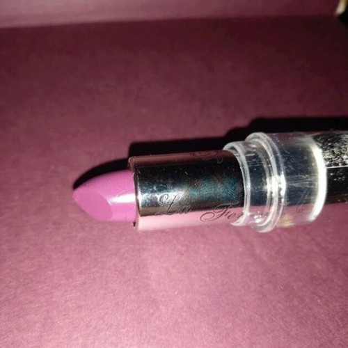 Purple lipstick shiny new with subtle glitter