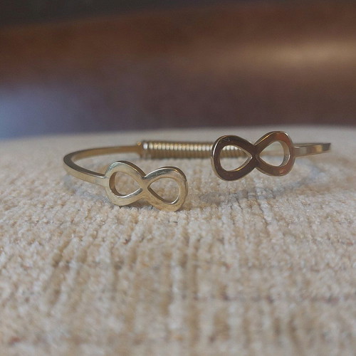 Gold infinity handcuff bracelet like new