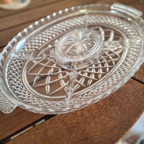 Crystal bowl with silver details and glass serving platter used for nuts