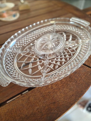 Crystal bowl with silver details and glass serving platter used for nuts