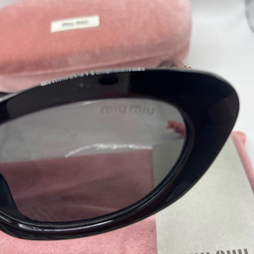 Miu Miu sunglasses new, black and gold for women
