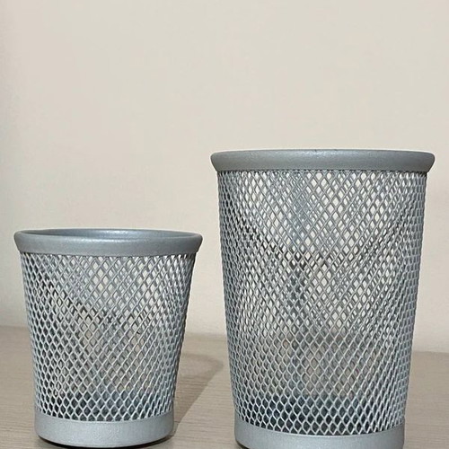 Gray pencil holders used with wear on inner bottom