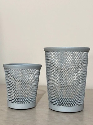 Gray pencil holders used with wear on inner bottom