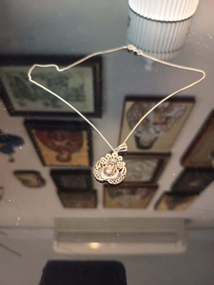 Silver motif with chain like new, gray
