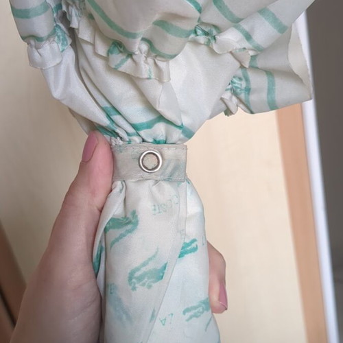 Lacoste vintage umbrella used with collectible Minnie Mouse