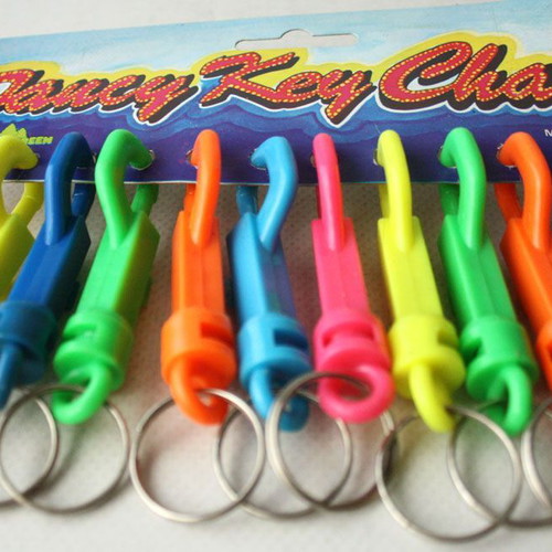 Card with 12 vintage 1980s phosphorescent key chains, new
