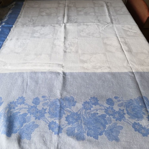 Aegean blue cotton tablecloth with floral woven patterns and lace trim