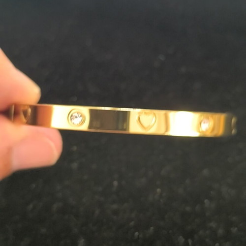 Gold Tone Bangle Bracelet with Hearts and Crystal Details new