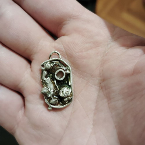 Silver pendant handmade with amethyst and liquid glass