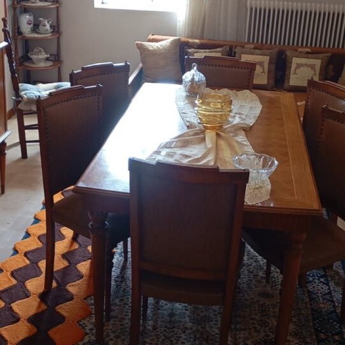 Wooden dining set used with leatherette chairs