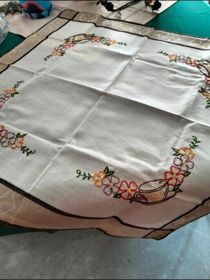 Embroidered square table linen with coffee cup and floral design