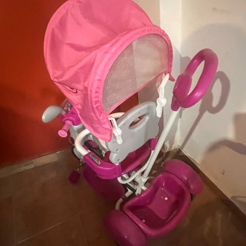 Tricycle like new with canopy, footrest and safety bar