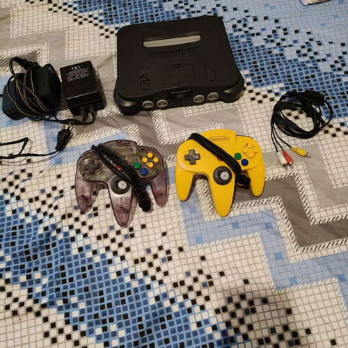 Nintendo 64 console used with jumper pack, power supply, cables, and two faulty controllers