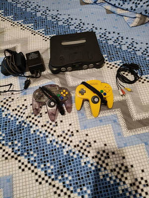 Nintendo 64 console used with jumper pack, power supply, cables, and two faulty controllers