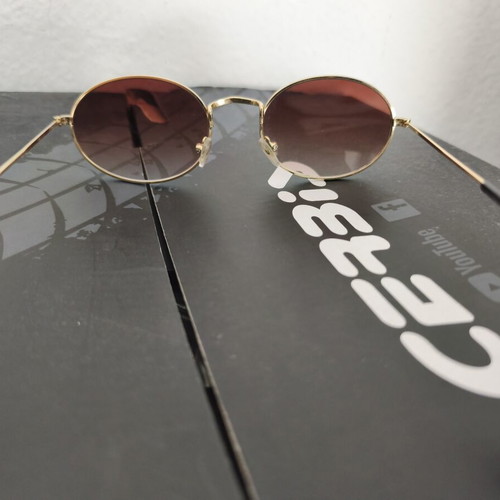 Ray Ban oval sunglasses like new, gold frame, gradient brown lenses