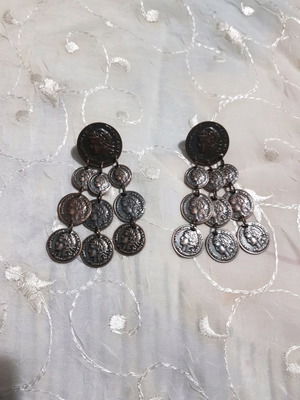 Bronze earrings with coins used