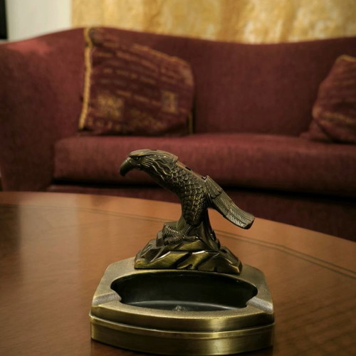 Metal ashtray lighter with two cigarette slots and plastic bird
