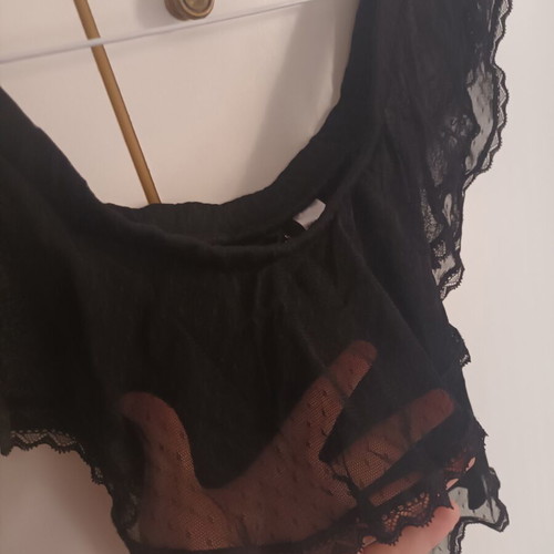 Black blouse with transparent polka dot design, off-shoulder
