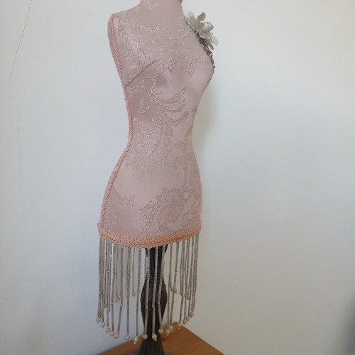 Decorative body like new with embossed designs and fringes