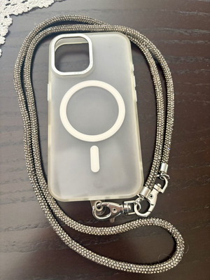 iPhone 16 case with detachable black rhinestone strap