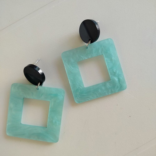 Statement earrings with aquamarine swirl resin square and black round base