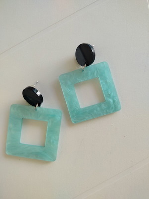 Statement earrings with aquamarine swirl resin square and black round base