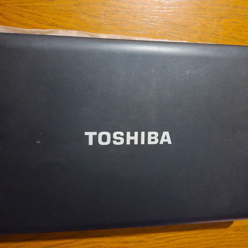 Toshiba laptop used, black, 13-inch, AMD E-Series, 2GB RAM, HDD, Windows