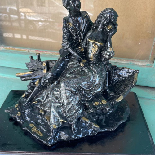 Vintage statue of a loving couple with wooden base like new